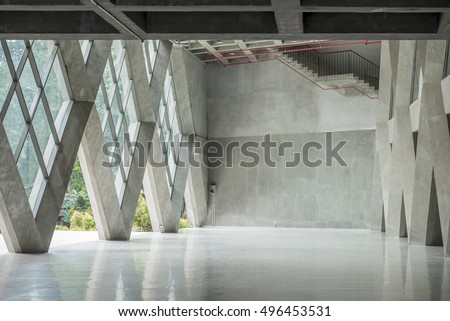 Empty modern loft with concrete  floor and big Windows