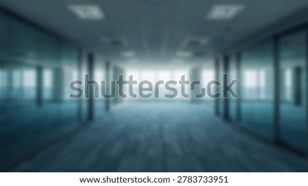 An empty modern office interior featuring glass walls, blue carpet, and a bright light source. The image showcases a clean and contemporary workspace, perfect for business and corporate themes.