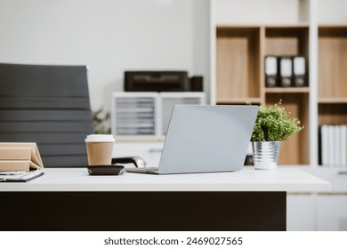 An empty, modern office space with a clean desk and sleek furniture offers a bright, comfortable workspace for business, featuring contemporary design elements and ample natural light. - Powered by Shutterstock