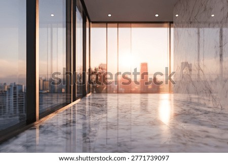 Empty modern office space with floor-to-ceiling windows showcasing a city skyline during a beautiful sunset.