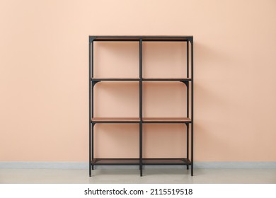 Empty Modern Shelf Unit Near Color Wall In Room