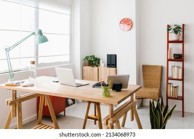 Empty modern workplace - Home office workspace with laptop computer and office supplies - Trendy desk work interior concept - Powered by Shutterstock