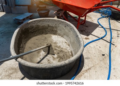 Empty mortar mixer and tools,  Cement mix concrete is compacted sand by spade for construction