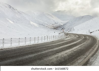 Empty mountain road on a cloudy winter day, South Island, New Zealand. - Powered by Shutterstock