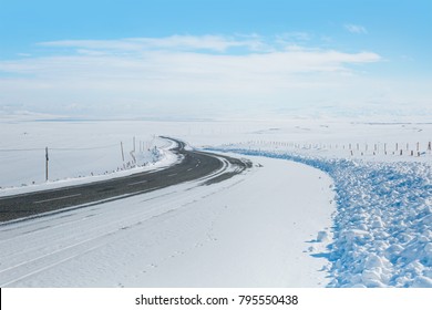 Empty mountain road on a cloudy winter day