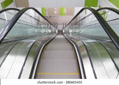 Empty moving escalator stairs from above in Sofia's subway.