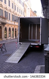 Empty Moving Truck With Loading Ramp At Rome Street