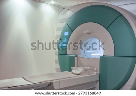 Empty mri scanner machine with empty patient bed table inside diagnostic department laboratory room of medical facility.