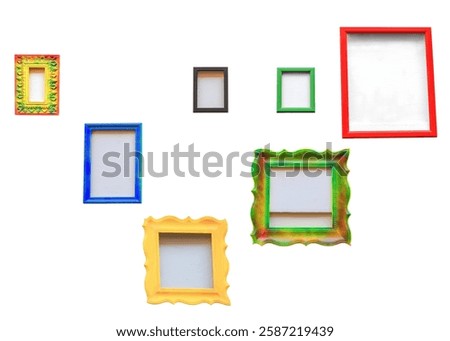 Empty multicolor photo frames isolated on white background. Collection of different painted photoframes for decorating home cutout. Variety color vintage wood picture frame set, cut out for design
