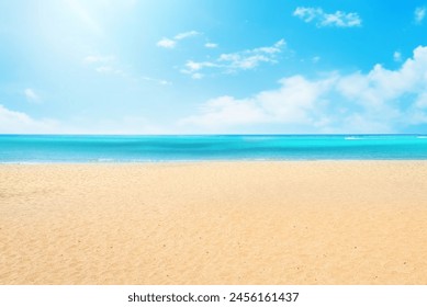 Empty natural beach background with golden sand and blue sky with white clouds on a hot summer sunny day. - Powered by Shutterstock