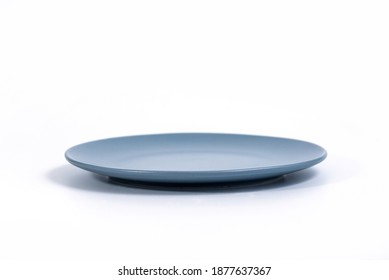 Empty Navy Blue Plate Isolated On White Background Side View, Selective Focus