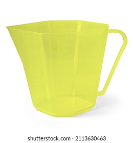 Empty neon green plastic jug with narrow spout opening and long handle on white background. Closeup.
