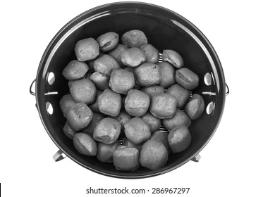 Empty New Clean BBQ Kettle Grill With Charcoal Briquettes In The Pit Isolated On White Background Overhead View