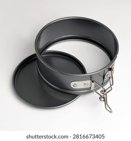 Empty new opened springform cake tin isolated on white background