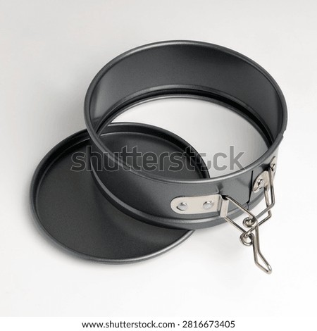 Empty new opened springform cake tin isolated on white background