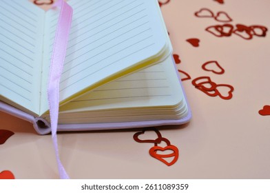 empty notebook between hearts - happy valentines day - february 14