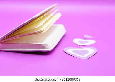 empty notebook between hearts - happy valentines day - february 14