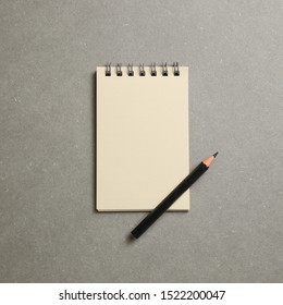 Empty notepad on gray background - Powered by Shutterstock