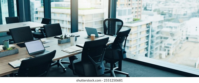 Empty, notes and chairs by table for conference room, corporate company and meeting boardroom. Vacant, interior furniture and laptop in workplace for planning, business brief and tech agency in Japan