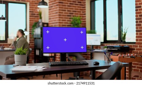 Empty office desk with greenscreen display on computer desktop, isolated chroma key background with mockup template. Monitor with blank screen used by business people in startup office. - Shutterstock ID 2174911531