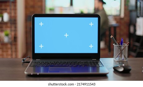 Empty office desk with greenscreen display on wireless laptop, used by employees at corporate job. Blank chroma key background with isolated copyspace template and mockup screen. - Shutterstock ID 2174911543