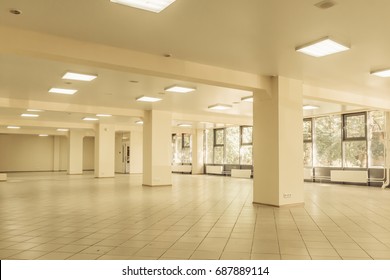 empty office room interior,   tiled floors and windows - Shutterstock ID 687889114