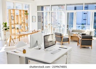 Empty Office Room, Workplace Or Interior With An Arranged Desk, Computers And Furniture. Corporate Organized Work Space, Business Company Working Area Or Modern Headquarters Workspace