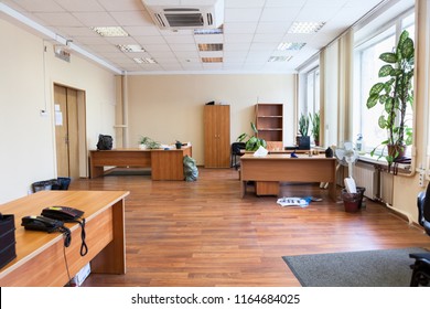 Empty office space with desks, cabinets and flowers after removal, nobody - Shutterstock ID 1164684025