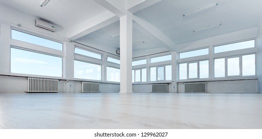 Empty Office Space With Large Windows