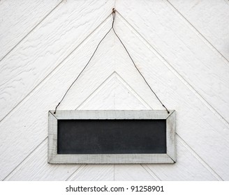 Empty Old Blackboard Sign, Hanging On A Wooden Wall Or Door