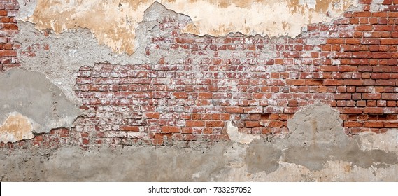 Empty Old Brick Wall Texture. Painted Distressed Wall Surface. Grungy Wide Brickwall. Grunge Red Stonewall Background. Shabby Building Facade With Damaged Plaster. Abstract Web Banner. Copy Space. - Shutterstock ID 733257052