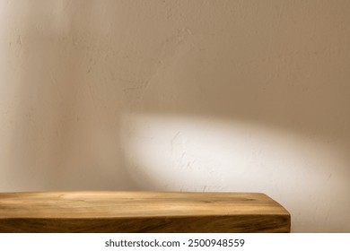 Empty old brown table corner on beige stucco wall background. Mock up for presentation, branding products, cosmetics food or jewelry.