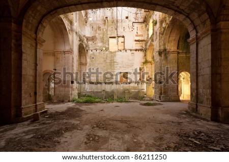 Empty and old church hall covered by nature