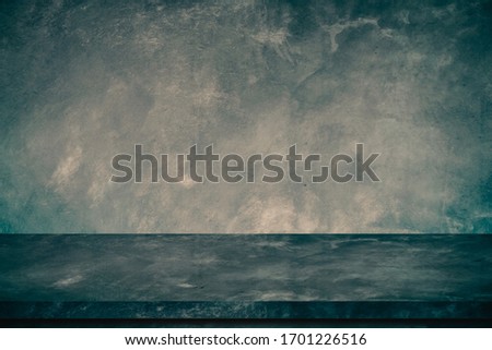 Empty old concrete table with raw cement wall background.