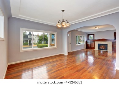 Empty Old House Interior. Entryway With Hardwood Floor And Lavender Walls. Living Room. Northwest, USA