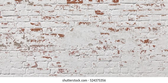 Empty Old White Red Brick Wall Texture. Painted Distressed Wall Surface. Grungy Wide Brickwall. Grunge Red Stonewall Background. Shabby Building Facade With Damaged Plaster.  Abstract Wide Web Banner.