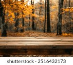 empty old wooden table top with blur background in the woods, fall aesthetic. mockup. product photography background. autumn vibe 