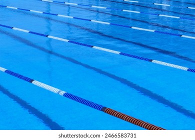 empty Olympic swimming pool , blue water , rope pool dividers design element - Powered by Shutterstock