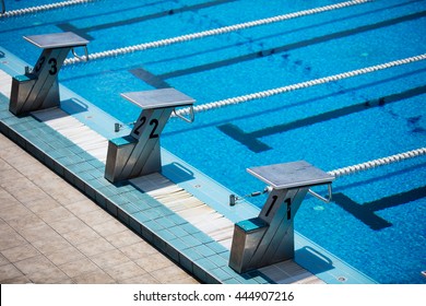 Empty Olympic Swimming Pool With Clear Blue Water