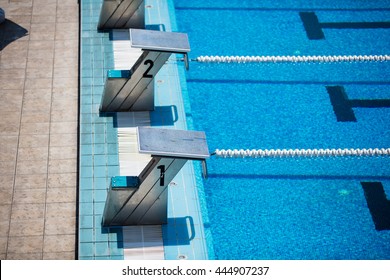 Empty Olympic Swimming Pool With Clear Blue Water