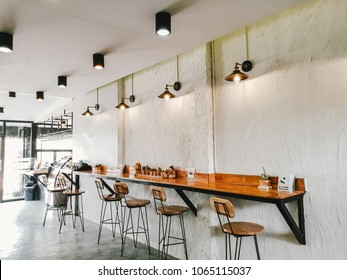 Empty on people . Coffee shop   interior design With chairs and white walls. - Shutterstock ID 1065115037