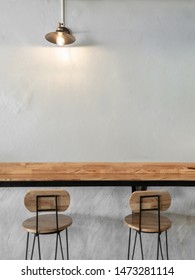 Empty on people. Coffee shop interior design With chairs, vintage light bulb and white walls.