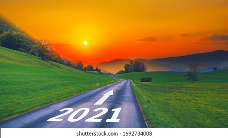 Empty Open Asphalt Road And New Year 2022 Concept. Driving On Empty Road Goals Against Sun In Mountains To Upcoming 2021 And Leaving Behind Old Years. Concept For Growth Success, Passing Time Future.