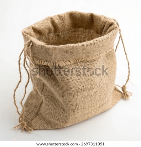Empty Open Burlap or Jute Sack with Drawstrings on a White Background