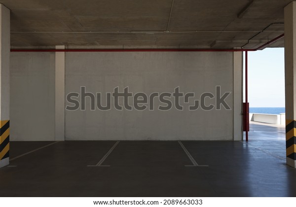 Empty open car\
parking garage on sunny\
day