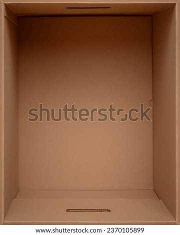 Empty open cardboard box for things, close-up. Top view. Packing for cargo.