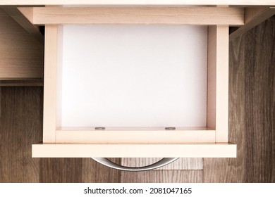 Empty open pull-out furniture drawer, top view