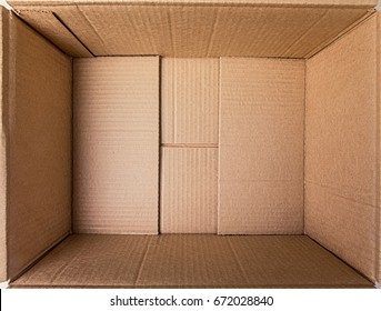 Empty open rectangular cardboard box close up. - Shutterstock ID 672028840