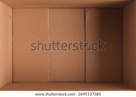 Empty open rectangular cardboard box close up. top view