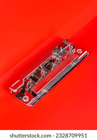 Empty open red  folder for papers with a metal clip, close up 
